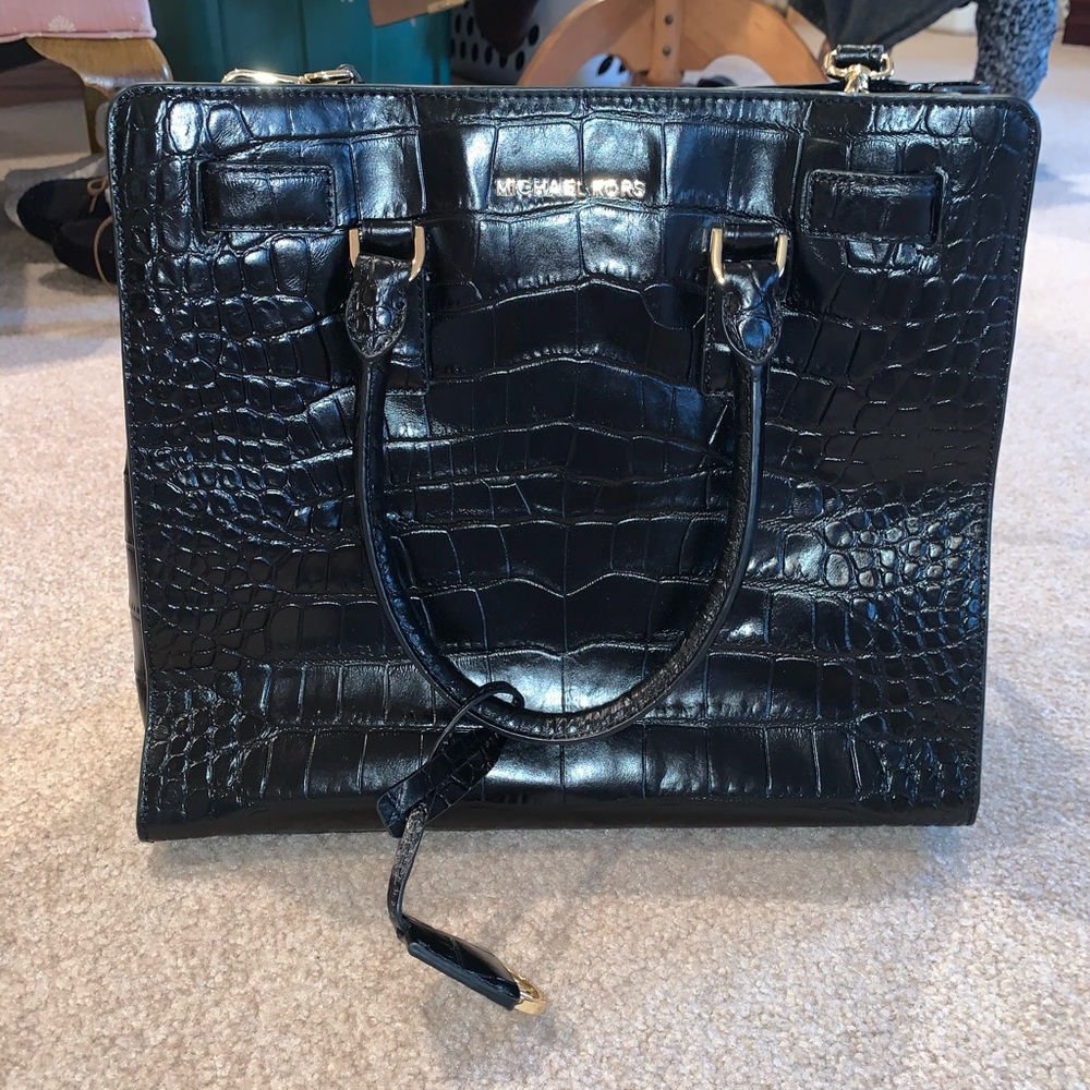 Black snake print large Michael kors purse.